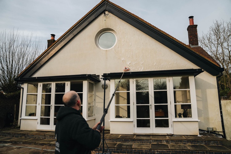 Professional render cleaning in progress using soft wash equipment on a Nottingham property